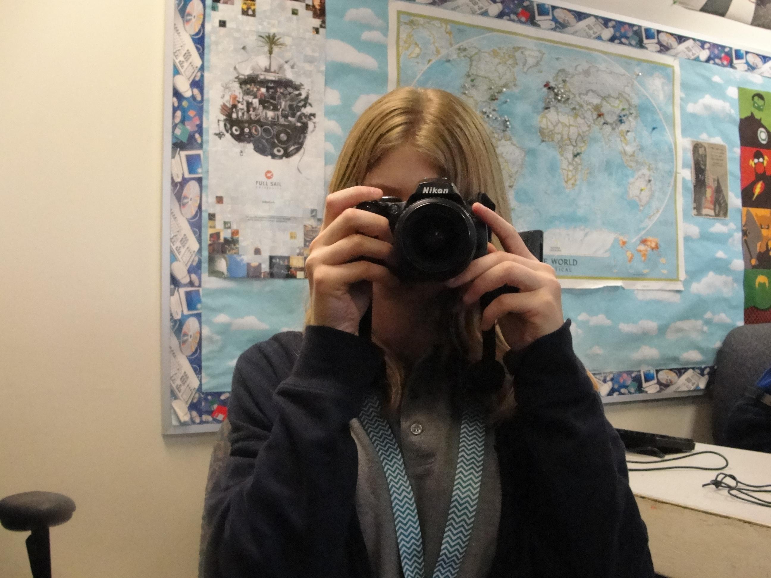 Female Student with Camera